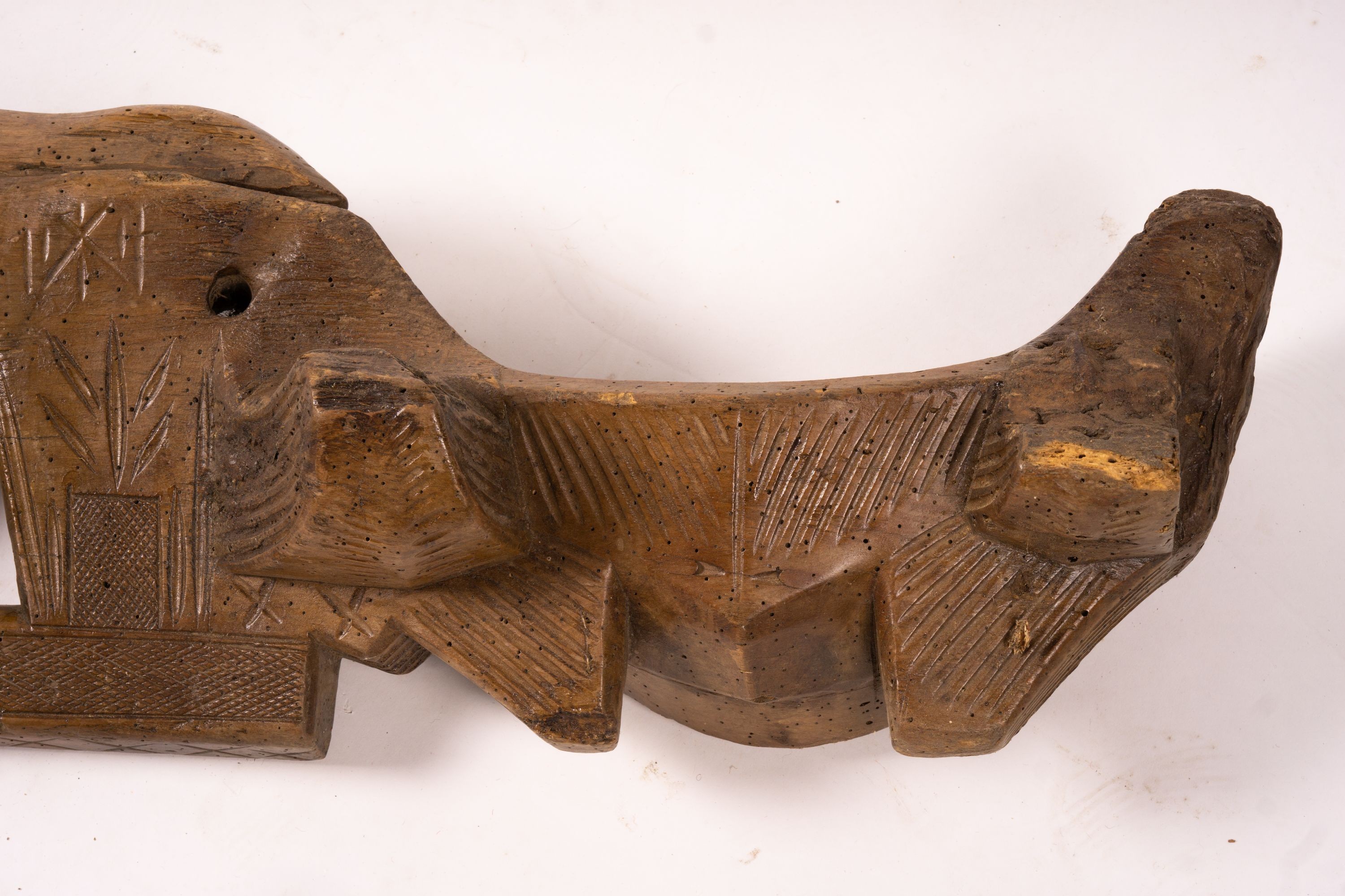 A 19th century Spanish carved fruitwood ox yoke, length 108cm